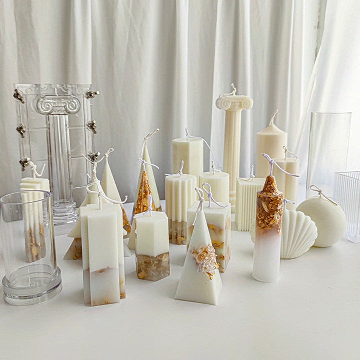 Acrylic Candle Mold by Arts And More with various uniquely shaped decorative candles on white surface