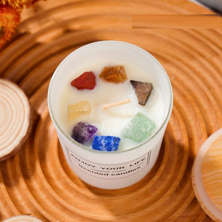 Aromatherapy Candle with colorful gemstones on top in a white jar for relaxing ambiance
