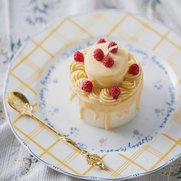 Elegant cake with birthday candle on a decorative plate, perfect for birthday celebrations