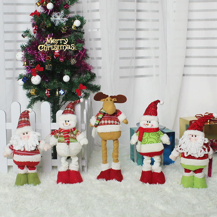 Cute Christmas decorations featuring plush characters near a decorated tree in a festive setting