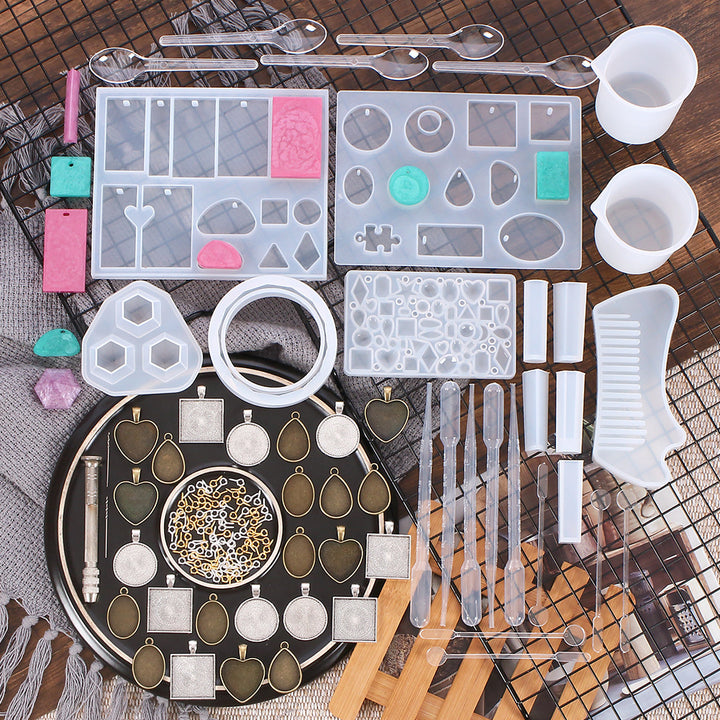 Crystal Glue Tool Jewelry Making Set with various molds, tools, and decorative elements for crafting jewelry