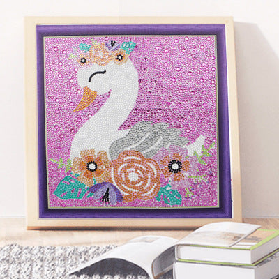 Colorful diamond painting kit featuring a swan design with floral accents in a framed display