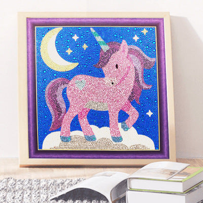 Diamond Painting Kit featuring a colorful unicorn design with stars and moon in a framed artwork