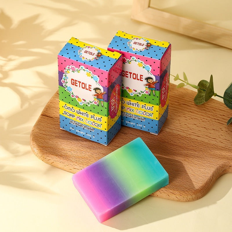 Oil Bath Soap for Kids by Arts And More colorful rainbow bar with playful packaging on wooden tray