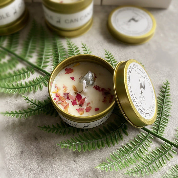 Gold Tin Box Scented Candle with Floral Embellishments on a Fern Background