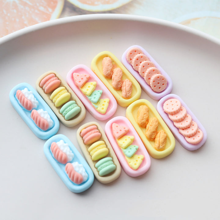 Arts And More resin ornament accessories with colorful miniature food designs on oval bases