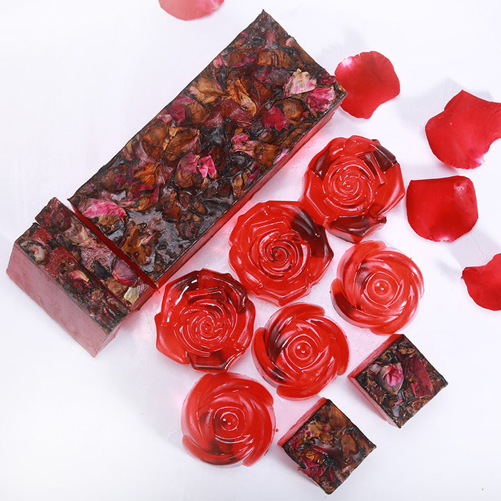 Arts And More Rose Oil Soap bars with dried rose petals and red rose-shaped soap pieces on white background