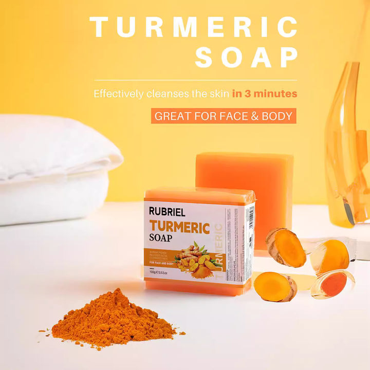Arts And More Turmeric Soap bar with turmeric powder and sliced turmeric roots on white surface