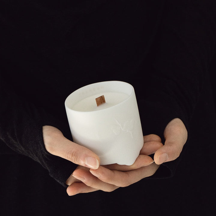 Arts And More Snow Moon Scented Candles in a stylish white holder, perfect for creating a cozy atmosphere