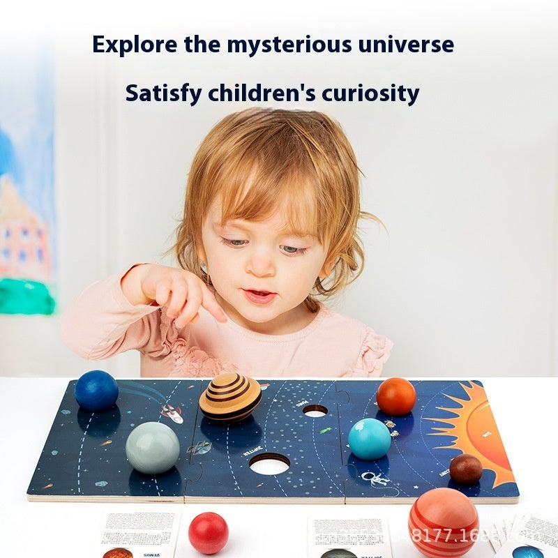 Child playing with Arts And More Solar System Puzzle from kids DIY kits exploring planets