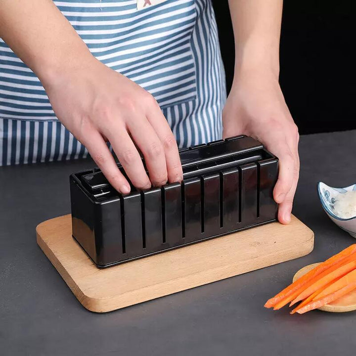 Arts And More Sushi Making Kit with a user pressing rice into the mold for perfect sushi rolls