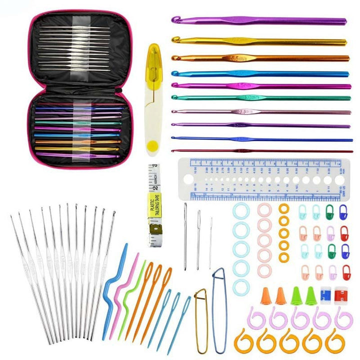 Arts And More crochet set with colorful hooks, needles, measuring tape, stitch markers, and crochet accessories in a pink case
