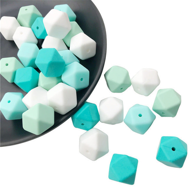 Hexagon beads in white, teal, and mint green colors for crafting projects by Arts And More