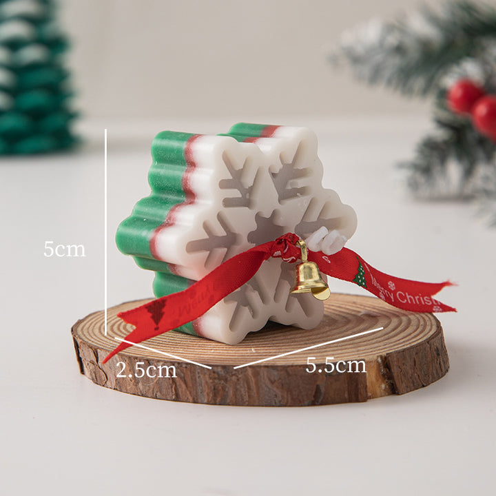 Snowflake Aromatherapy Candle in festive colors with decorative ribbon and bell for holiday decor