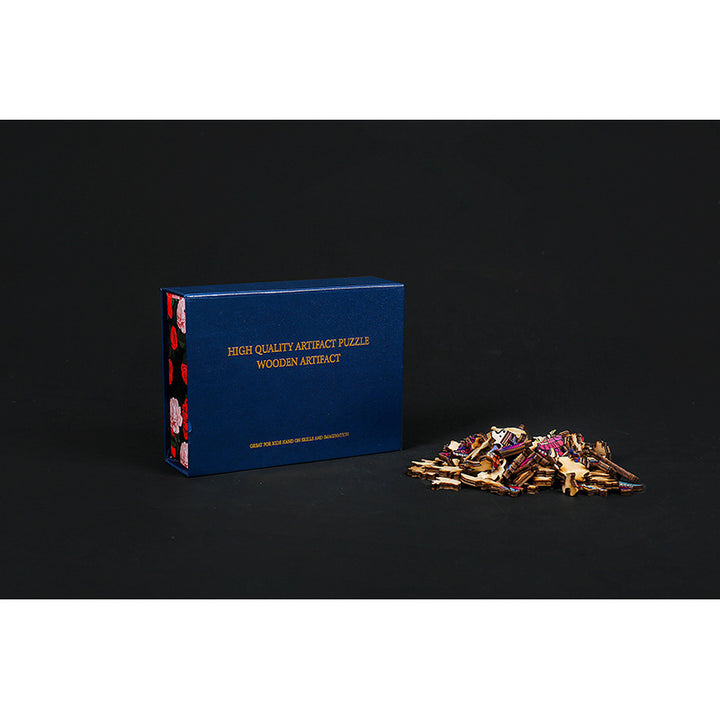 Arts And More Wooden Dinosaur Puzzle kit with blue box and wooden puzzle pieces laid out