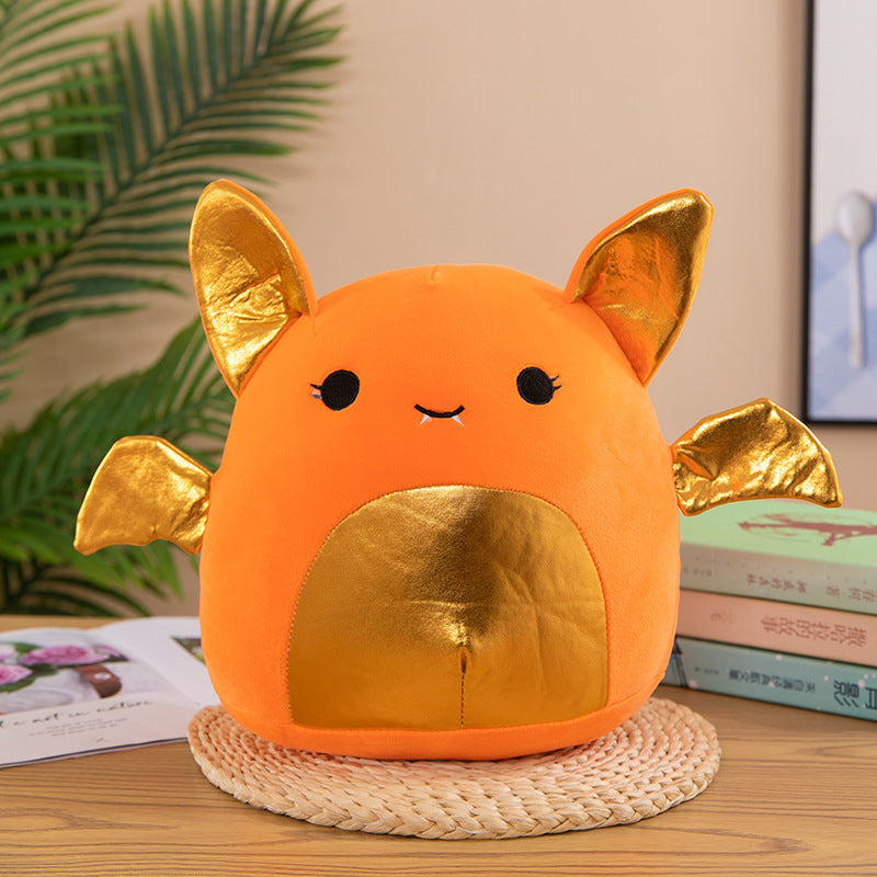 Arts And More kids DIY Animal Plush Pillow in orange with gold ears and wings on a wooden table
