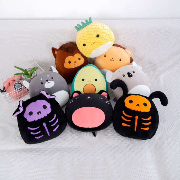 Arts And More Kids’ DIY Kits featuring a colorful collection of animal plush pillow designs on a white couch