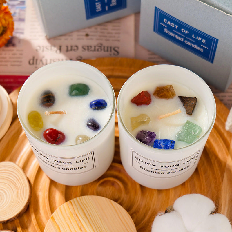 Aromatherapy Candle adorned with colorful crystals in a white container for relaxation and ambiance