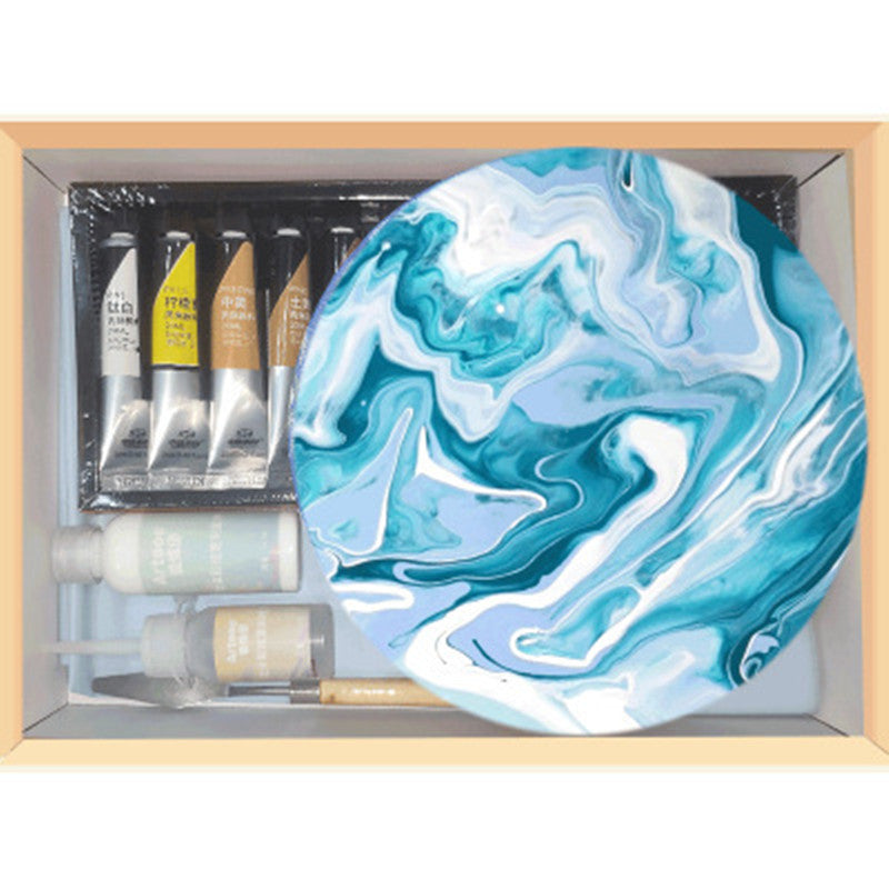 Arts And More Fluid Painting Water Shadow Painting Tools kit with paint tubes, bottles, and a round blue and white marbled canvas