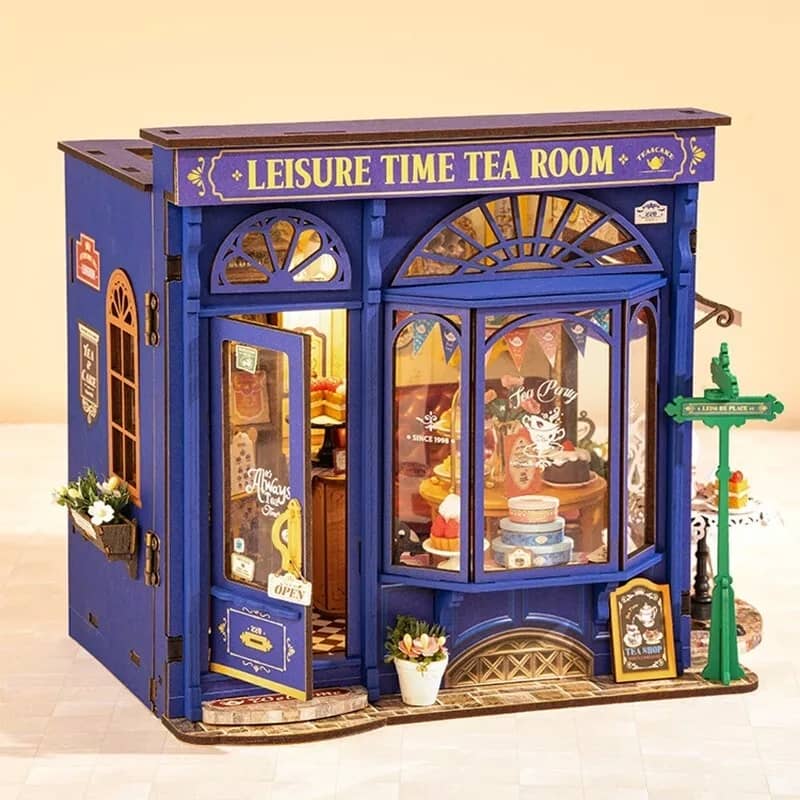 Model of a tea room with a blue exterior and 'Leisure Time Tea Room' sign.