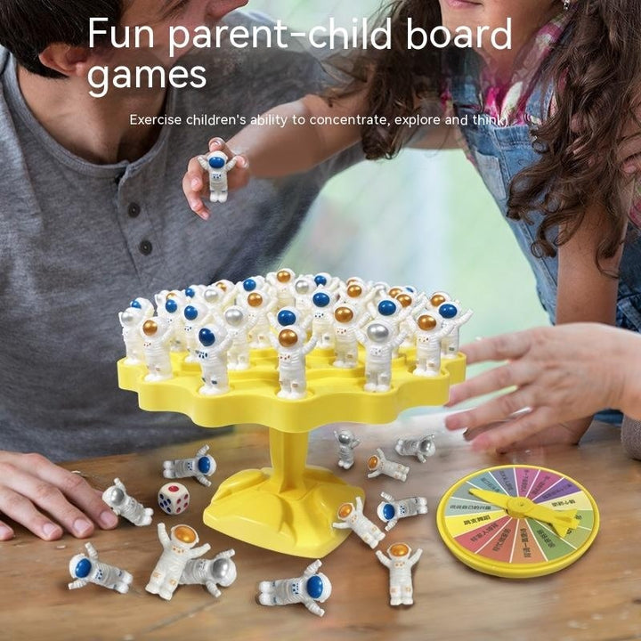 Balanced Space Station Game arts and crafts kit with astronauts on yellow stand and children playing