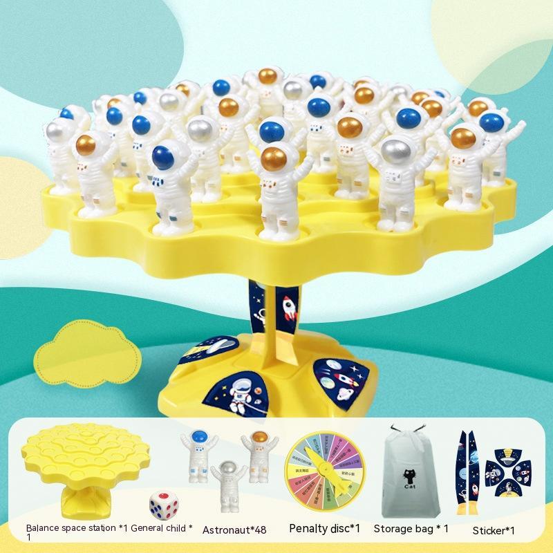 Balanced Space Station Game by Arts And More with astronaut figures, yellow base, penalty disc, dice, storage bag, and stickers