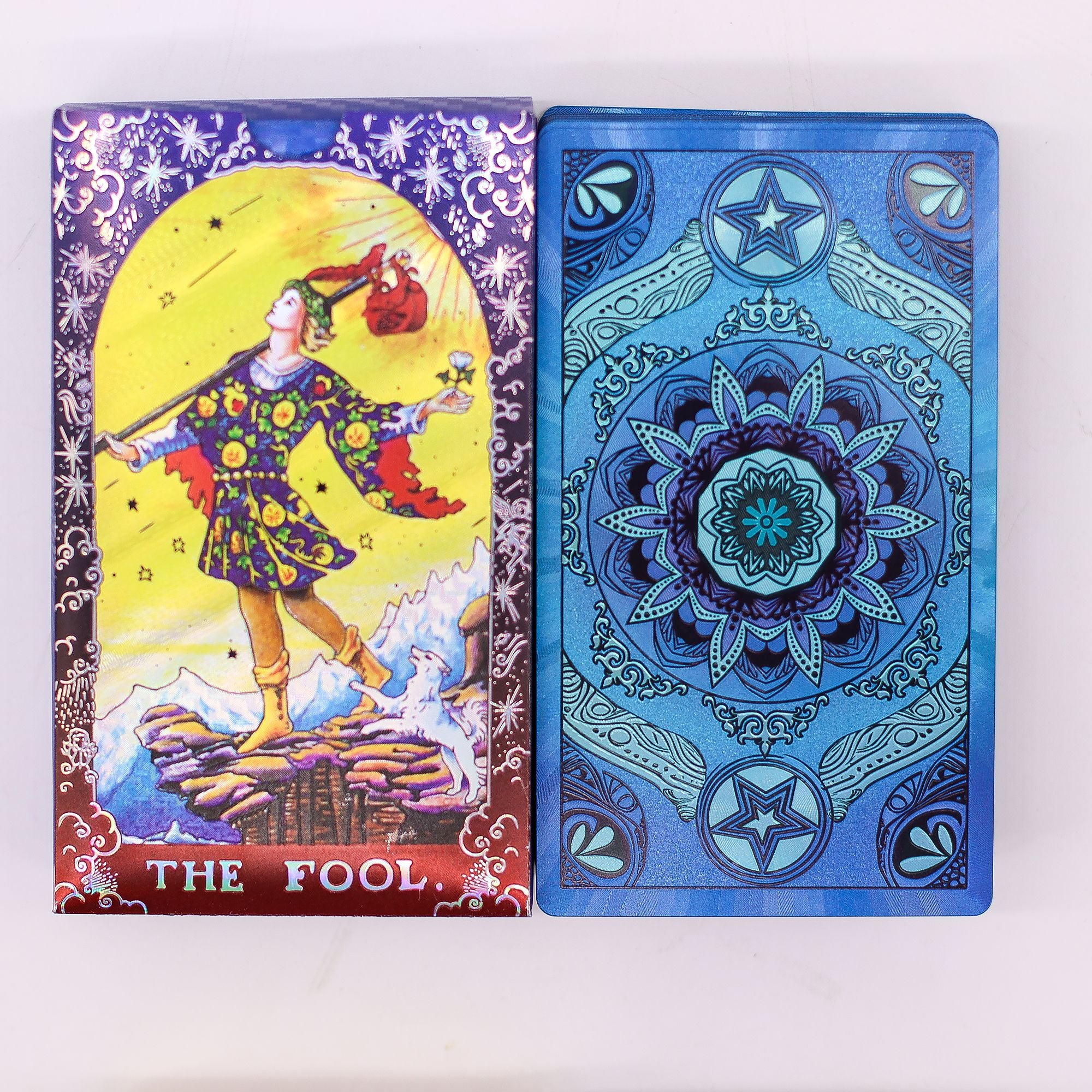 Blue Foil Mandala Tarot Card featuring The Fool illustration and vibrant design.