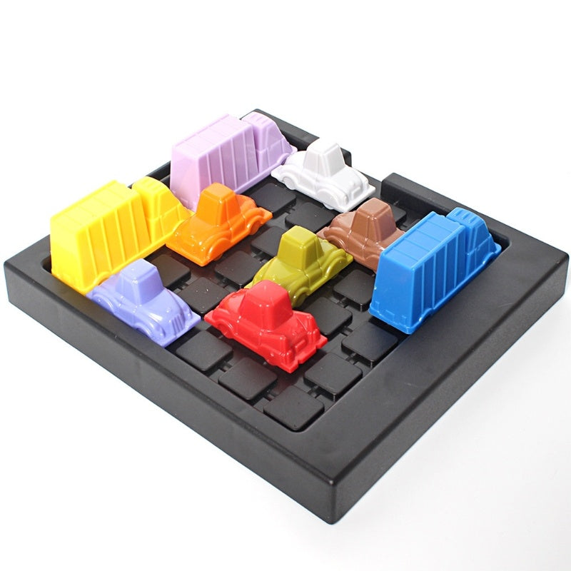 Arts And More Car Toy Puzzle with colorful plastic cars and trucks on black game board