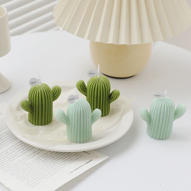 Cactus Candle Gift Box featuring four stylish cactus-shaped candles in green and light green shades