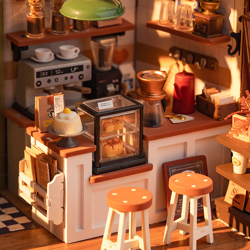 Cafe Miniature House Kit with detailed coffee station and cozy seating area for creative crafting