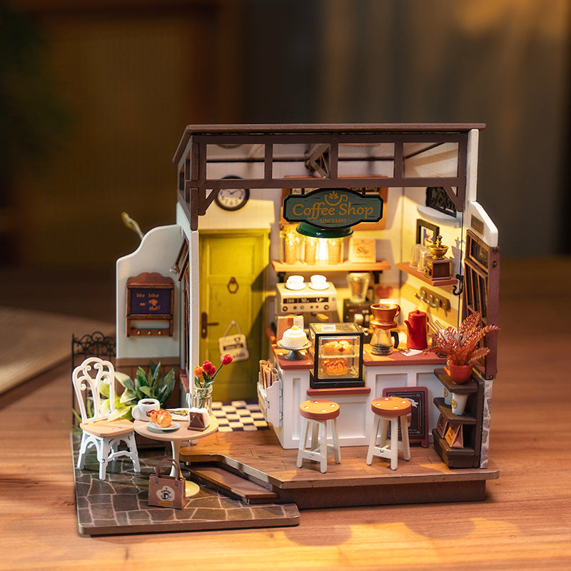 Robotime Rolife Cafe Miniature House Kit featuring a detailed coffee shop scene with furniture and decor