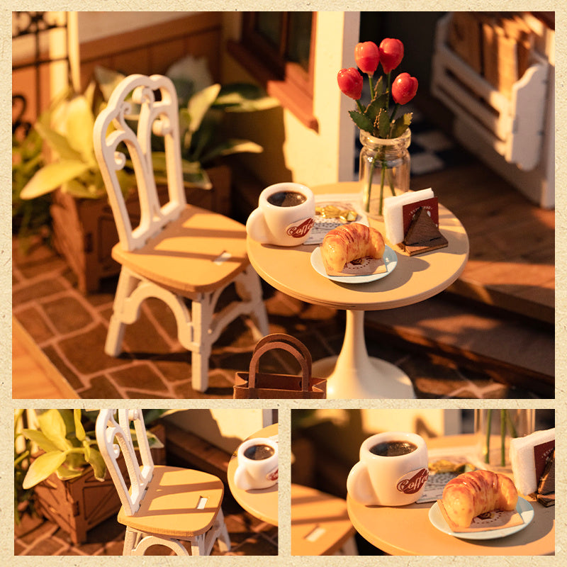 Cafe Miniature House Kit featuring a cozy table with coffee, pastries, and decorative flowers