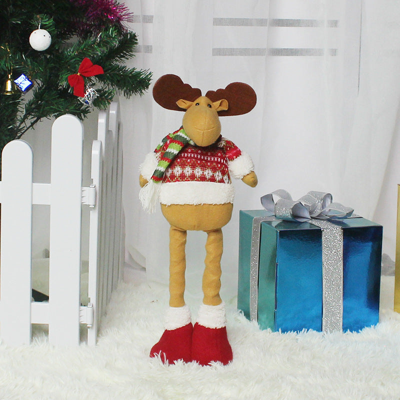 Playful Christmas decorations featuring a stuffed moose in a sweater by Arts And More for festive holiday cheer
