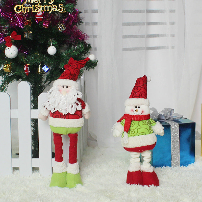 Festive Christmas decorations featuring Santa and snowman plush figures for holiday decor