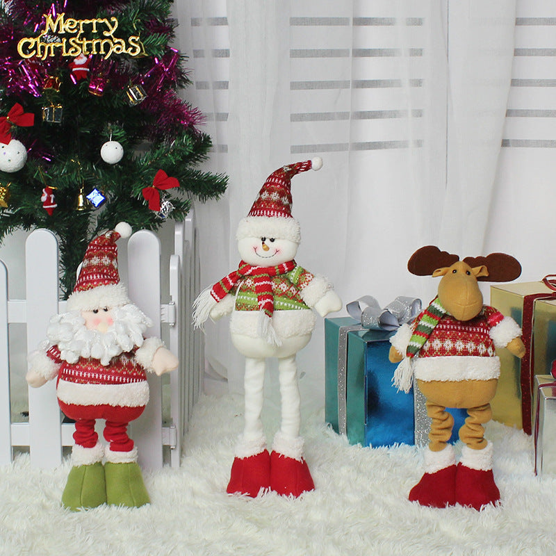 Festive Christmas decorations featuring plush characters including a snowman and reindeer by Arts And More