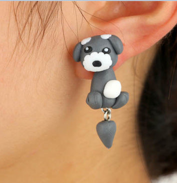 Arts And More gray and white Clay Animal Earrings shaped like a cute dog worn on ear
