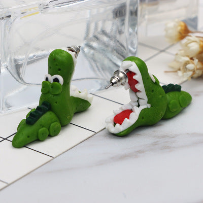 Arts And More green clay animal earrings shaped like crocodiles with detailed teeth and eyes