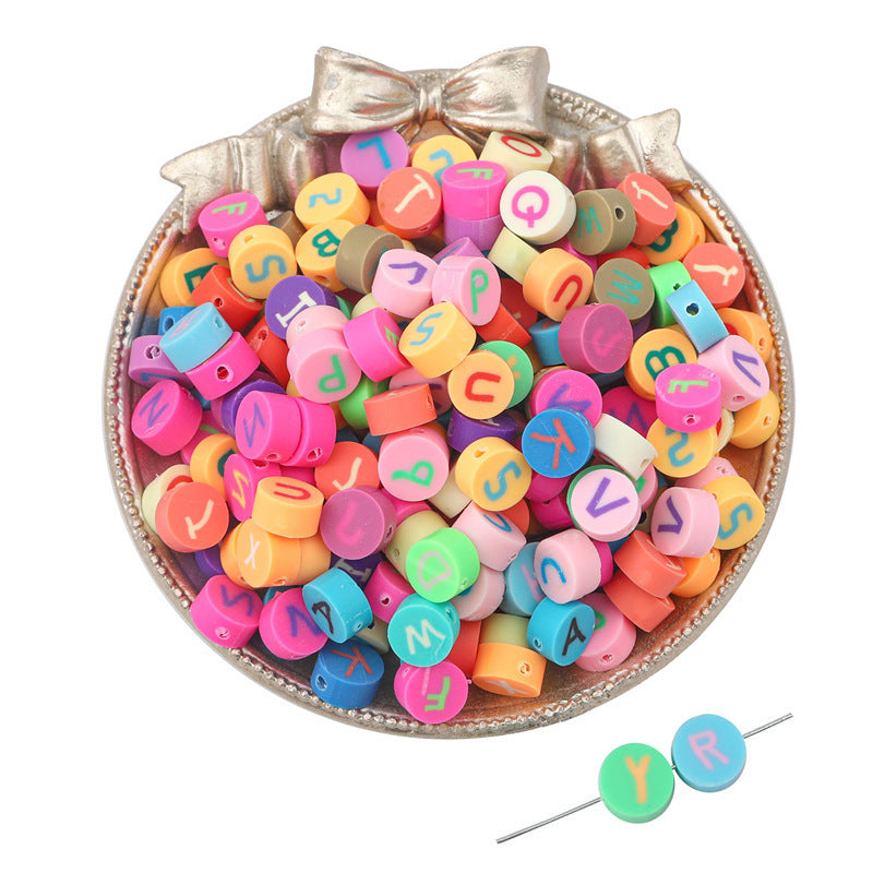 Colorful Arts And More clay beads with alphabet letters in a decorative silver bowl for craft projects