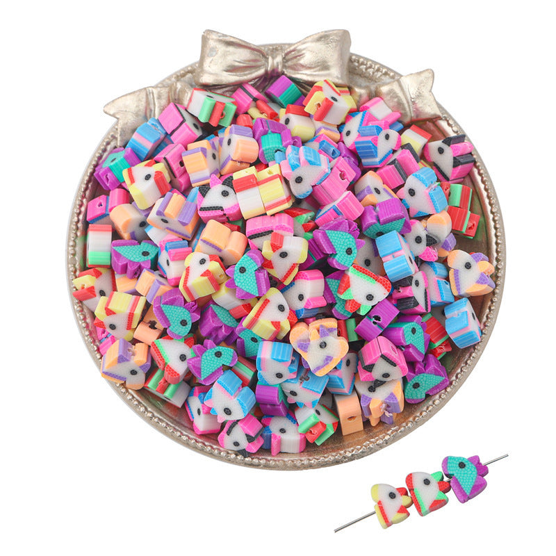 Colorful unicorn-shaped clay beads in a silver decorative bowl by Arts And More