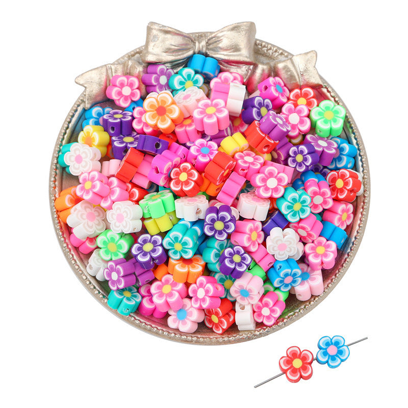 Colorful flower shaped Clay Beads in a decorative silver bowl for craft projects