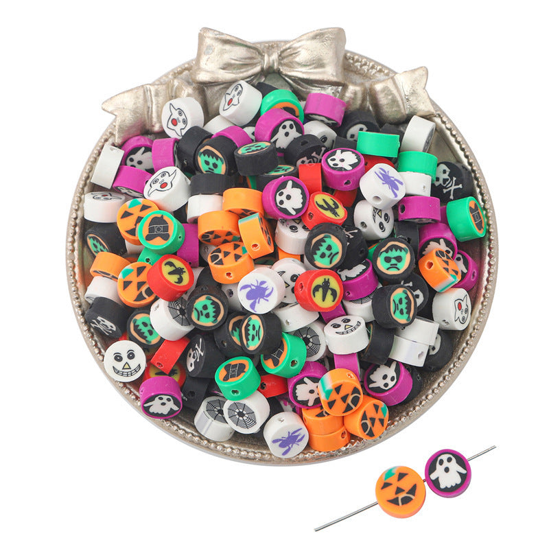 Colorful Halloween-themed clay beads with skulls pumpkins and ghosts in a decorative bowl for crafting