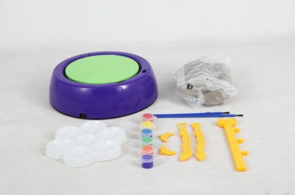 Clay Pottery Making Set with a pottery wheel, tools, and colored paints for creative crafting