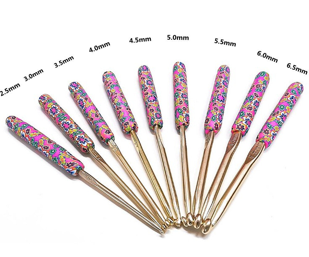 Arts And More crochet set with nine colorful floral handle crochet hooks in various sizes