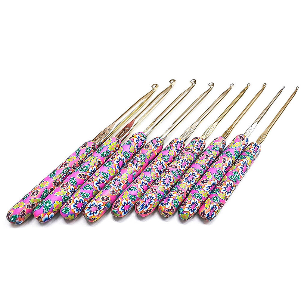 Arts And More crochet set with colorful floral patterned handles and various hook sizes