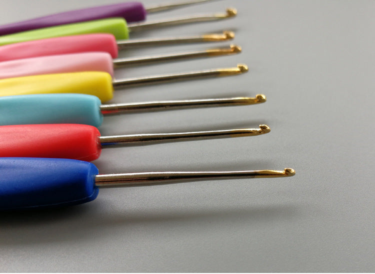 Arts And More crochet kit featuring colorful crochet tools with ergonomic handles in various sizes