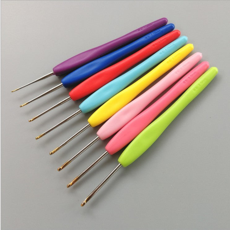 Colorful crochet hooks with ergonomic handles as essential crochet tools from Arts And More crochet kit