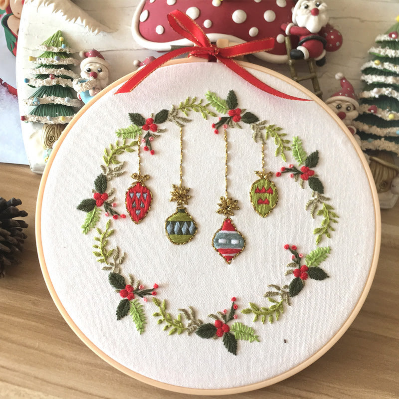 Beautiful Cross Stitch Kit featuring colorful ornaments and greenery, perfect for festive decorations