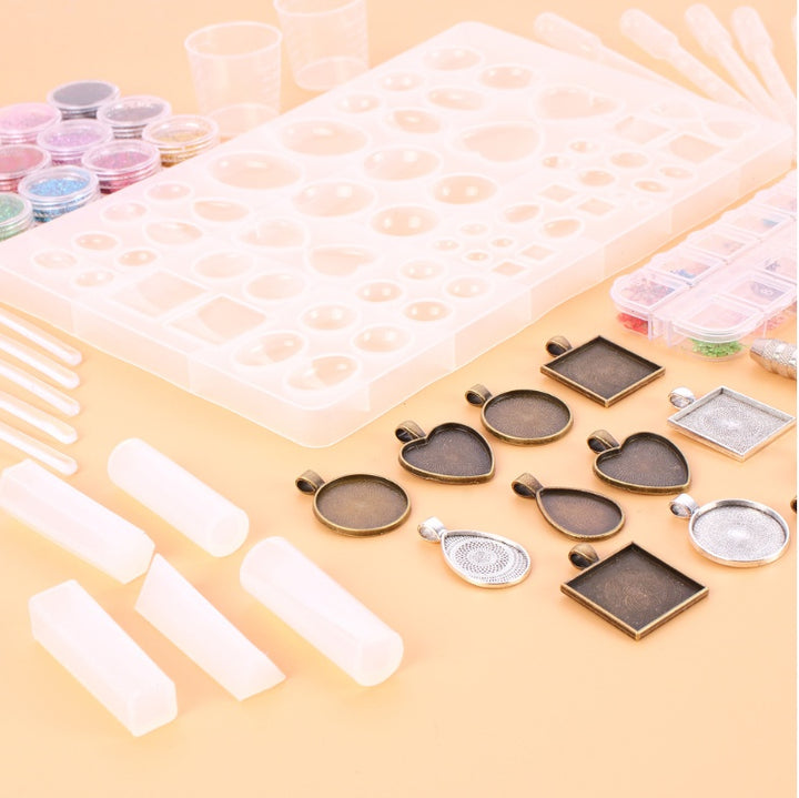 Arts And More Crystal Glue Mold Set with resin molds, pendant frames, glitter pots, and mixing tools for craft projects