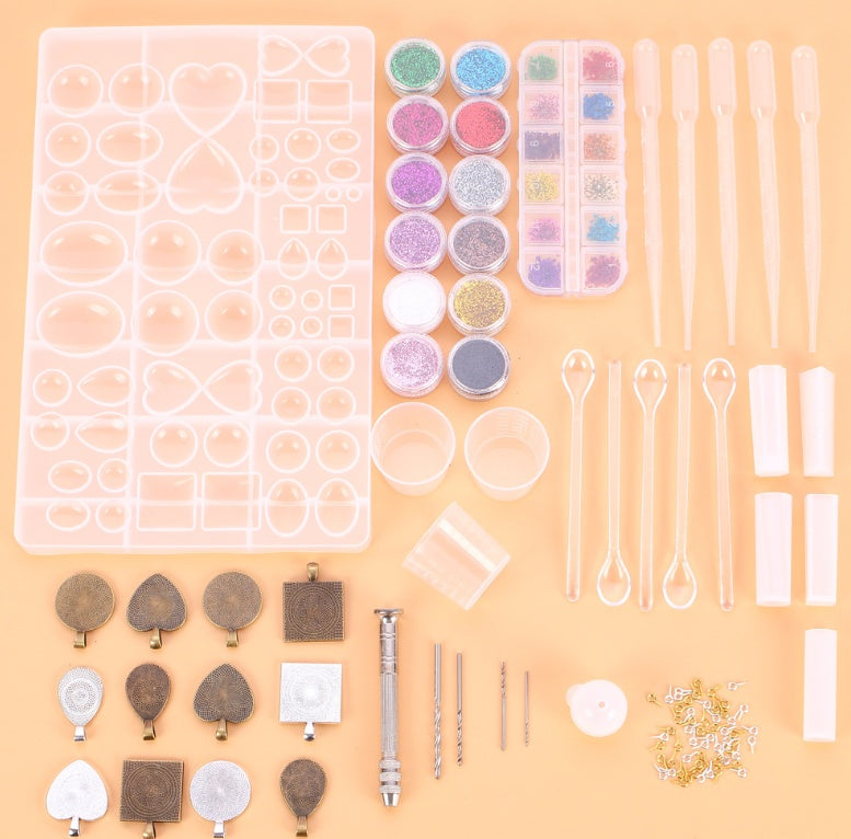 Arts And More Crystal Glue Mold Set with various silicone molds glitter powders droppers and crafting tools