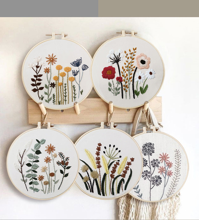 Dainty Stems Embroidery Kit featuring floral designs in decorative hoop frames for crafting enthusiasts